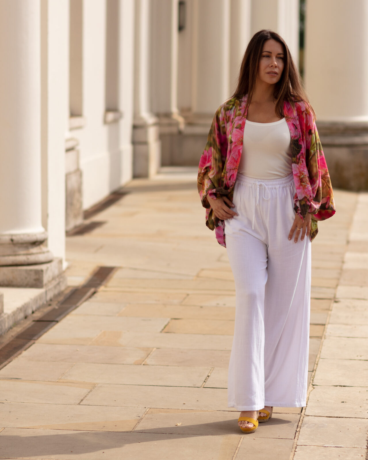 From My Mother's Garden Queen of the Border short kimono jacket in a silky smooth and sustainable fabric. It has a beautiful print of pink delphiniums