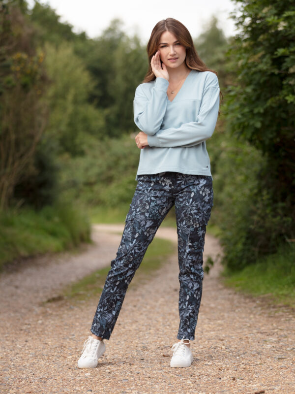 From My Mother's Garden Leaf Camo trousers in denim blue made of stretch cotton. These mid-rise trousers are a relaxed cigarette pant