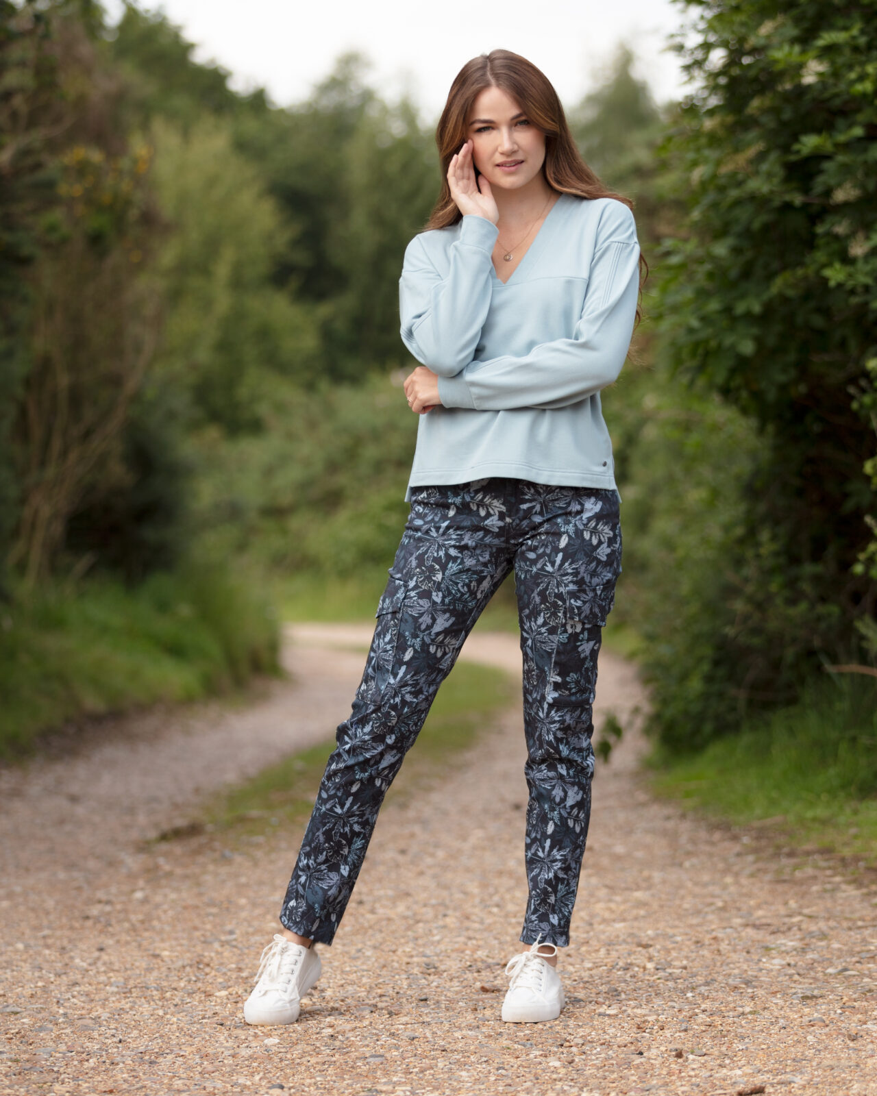 From My Mother's Garden Leaf Camo trousers in denim blue made of stretch cotton. These mid-rise trousers are a relaxed cigarette pant