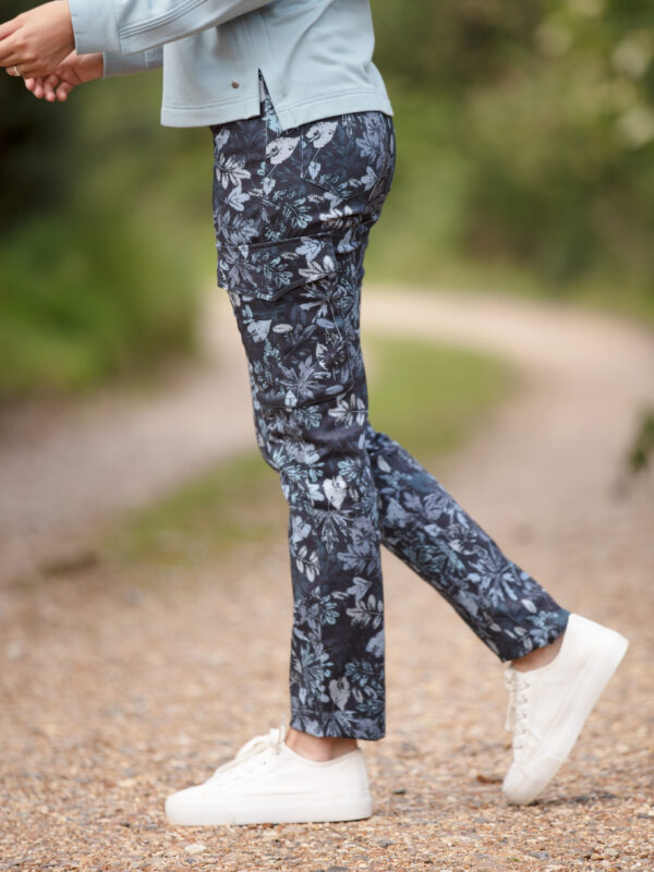 From My Mother's Garden Leaf Camo trousers in denim blue made of stretch cotton. These mid-rise trousers are a relaxed cigarette pant