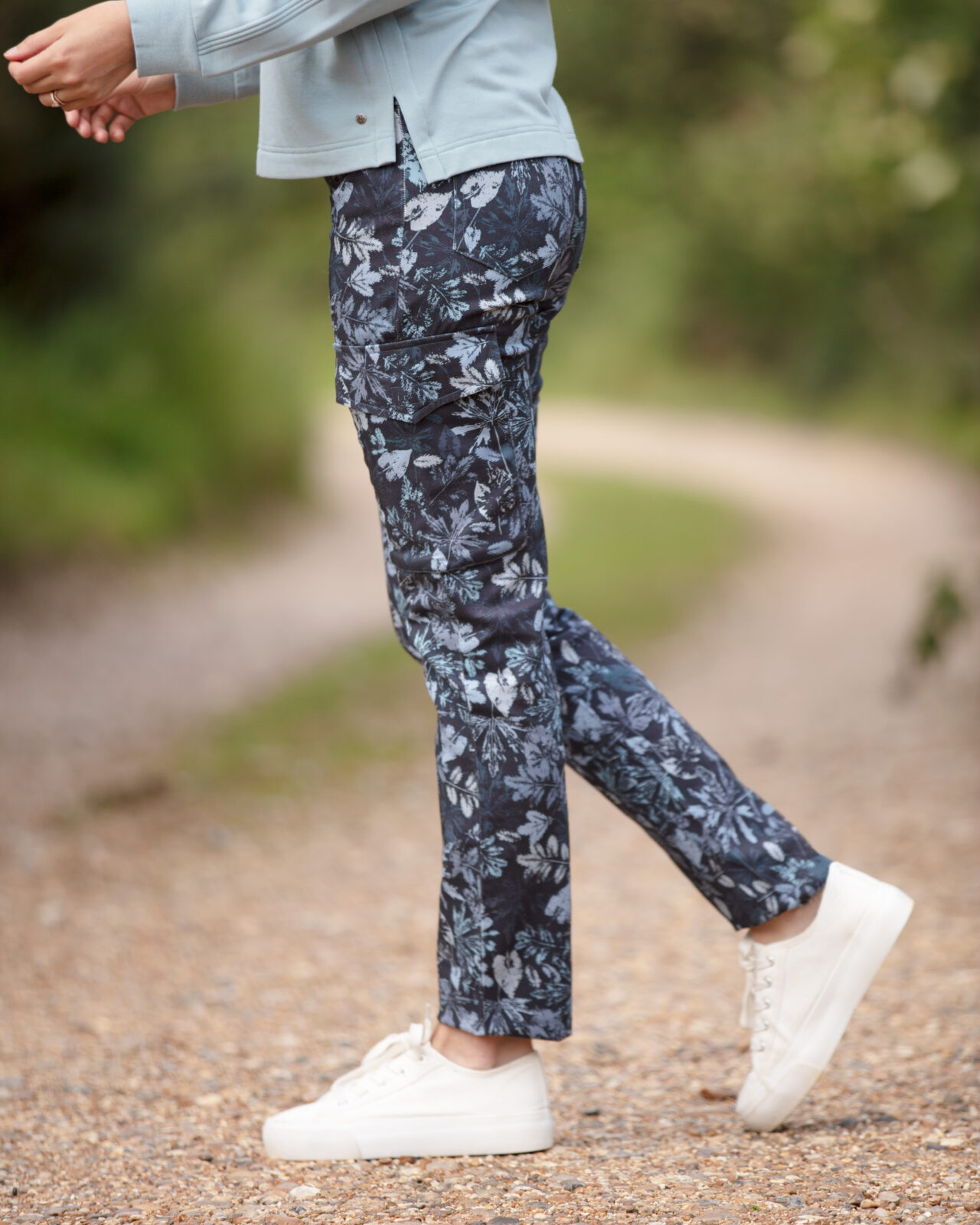 From My Mother's Garden Leaf Camo trousers in denim blue made of stretch cotton. These mid-rise trousers are a relaxed cigarette pant