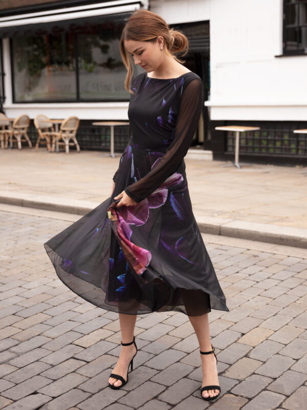 Deep As Dahlia Tulle Dress is a pretty and elegant party dress ideal for cocktail parties or a special occasion. The midi dress is black with a pretty floral print of dahlias. The Fit and Flare dress has semi sheer sleeves and a boat neckline. Perfect swish dress for dancing!
