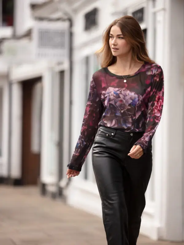 From My Mother's Garden Jewel Hydrangea Tulle Top made of a semi sheer mesh fabric with a scoop neckline and frilled sleeves for a romantic touch