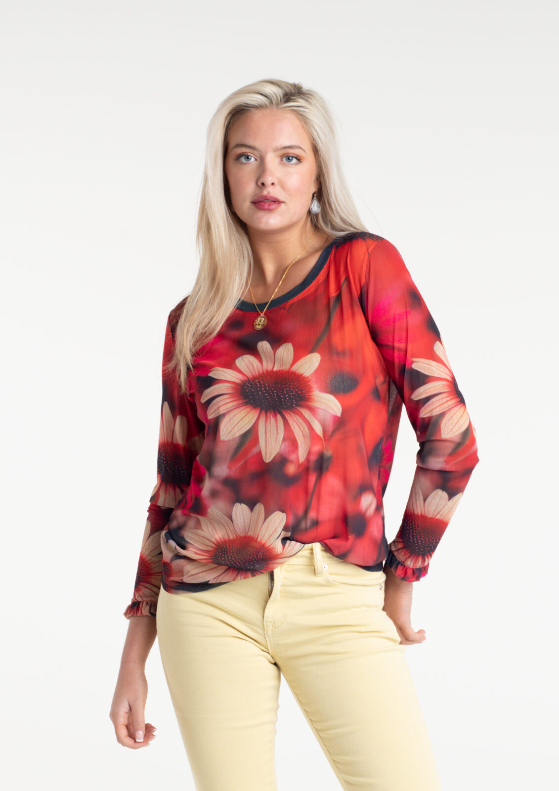 Dahlia Fire Tulle Top by From My Mother's Garden is a striking floral top with a scoop neckline and long sleeves. It has a Dahlia flower print on a red background
