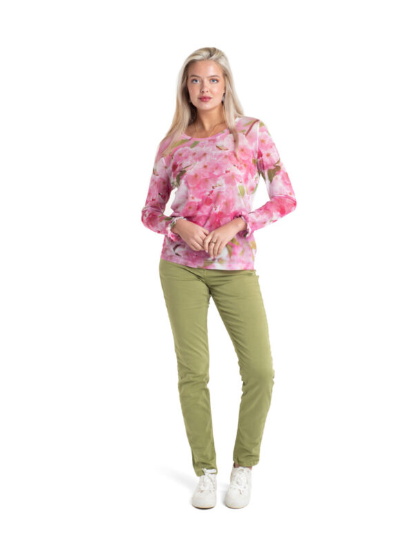 Cherry Blossom Tulle Top by From My Mother's Garden is a pretty, feminine top with a scoop neckline and long sleeves. It has a pink print on a white background