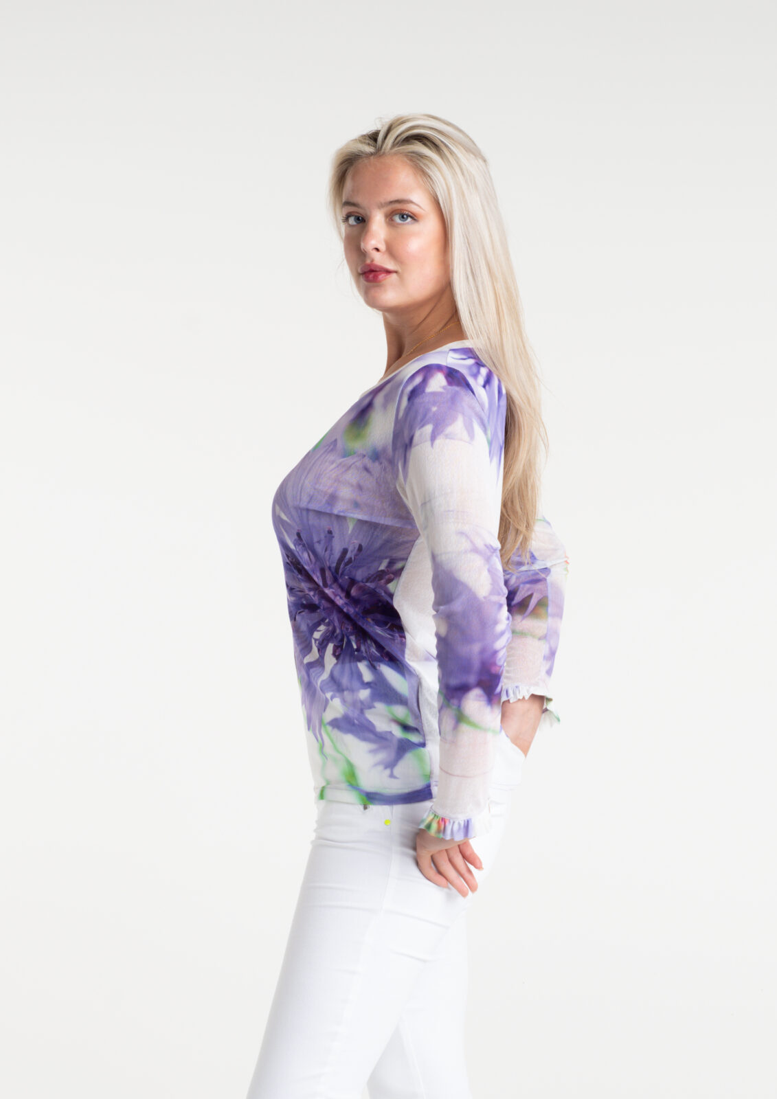 Cornflower Tulle Top by From My Mother's Garden is a pretty, feminine top with a scoop neckline and long sleeves. It has a Cornflower blue flower print on a white background