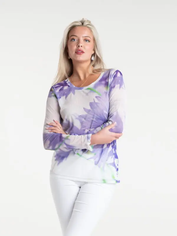 Cornflower Tulle Top by From My Mother's Garden is a pretty, feminine top with a scoop neckline and long sleeves. It has a Cornflower blue flower print on a white background