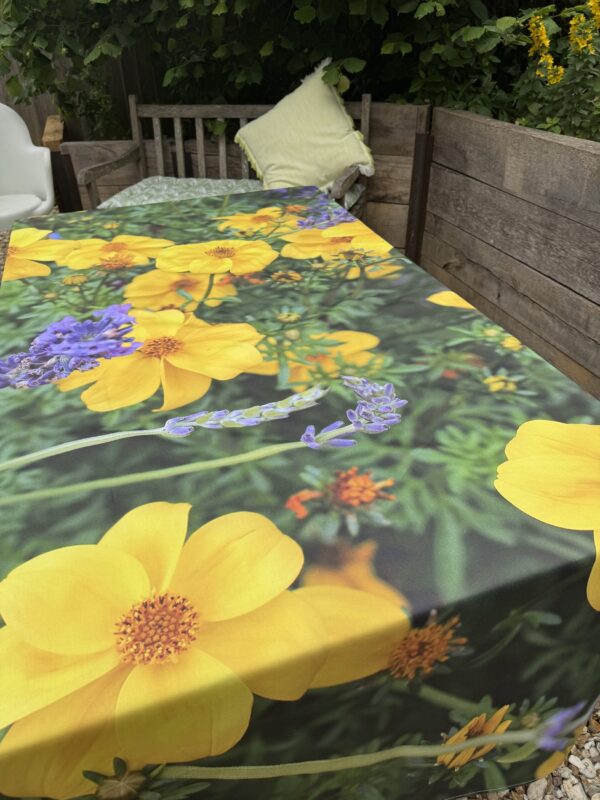 From My Mother's Garden Little Gem and Lavender Table Cloth is bright and happy. It is made from a heavyweight cotton drill