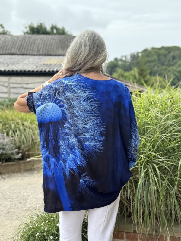 From My Mother's Garden Wishes Crepe Tunic Top is a wide, loose fit piece, perfect for when you're in a hot climate